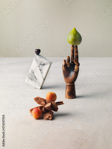 Conceptual still-life with varius object and fuit, figs, apricoat and cherry