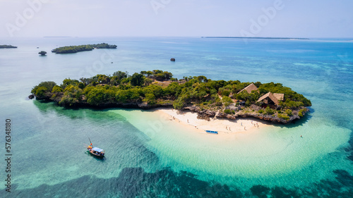 Tableau sur toile Board a traditional wooden dhow boat and discover the natural wonders of Zanzibar's Blue Safari, from coral reefs to deserted islands