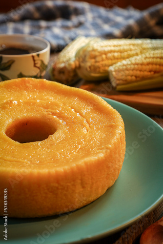 corn cake with a cup of coffee and ears of corn in the background