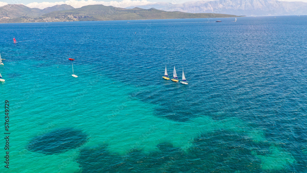 Aerial view of sailing boats and blue sea. Nikiana, Greece. Aerial view.