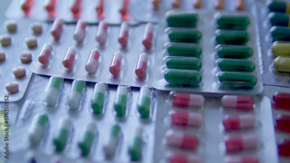 Closeup view to many pharmaceutical blister packs with pills and
