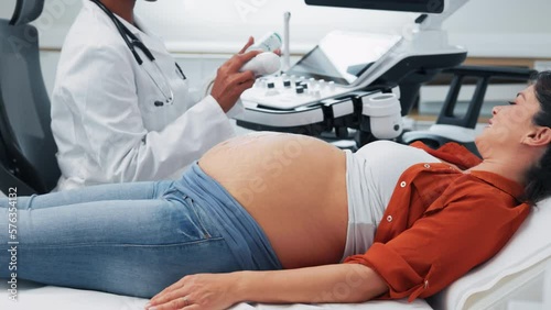 Pregnant Caucasian woman at ultrasound checkup.