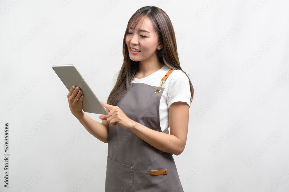 Portrait of young asian woman wearing apron over white background studio, cooking and entrepreneur concept. Portrait of young asian woman wearing apron over white background studio, cooking and entrepreneur concept.