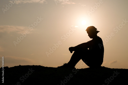 Silhouette of a man who is lonely and desperate because of neglect and unemployment. the concept of despair