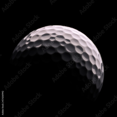 Close-up on a golf ball on a dark background and shadow