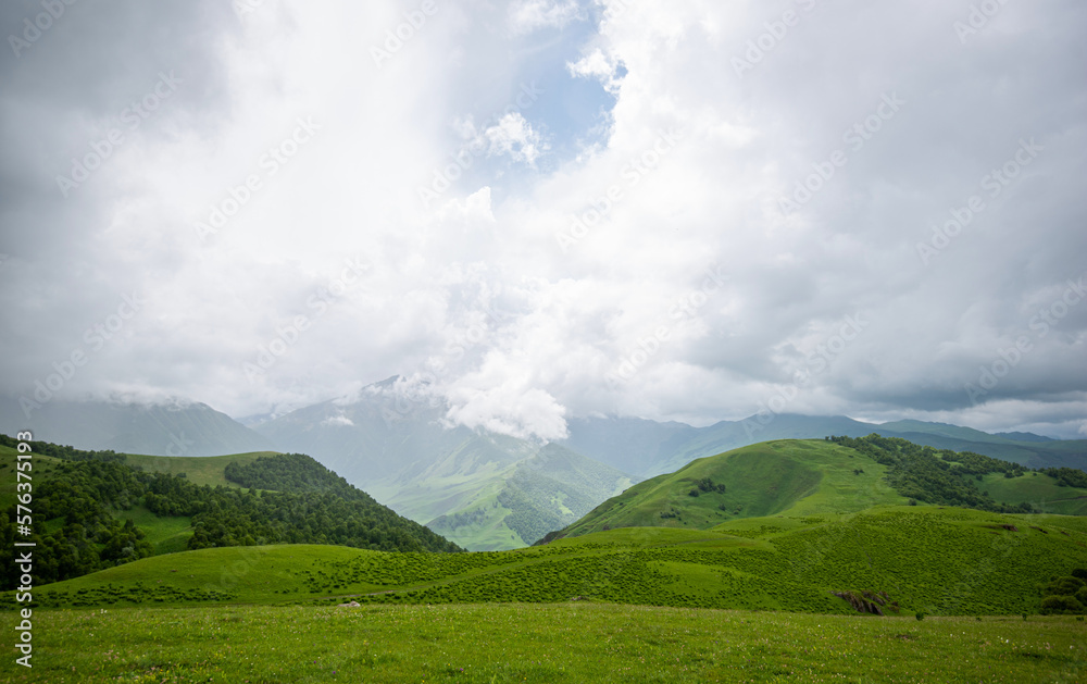 Amazing view of green mountains with clouds and dramatic sky. Majestic ...