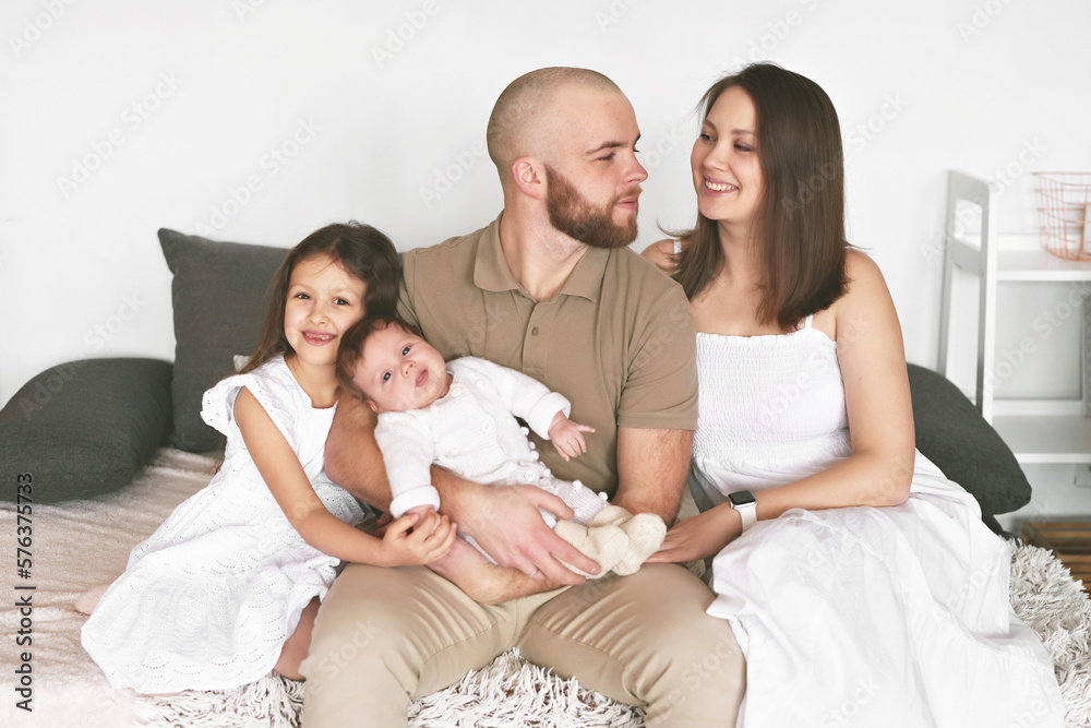 Mother's and Father's Day. Happy parents and children. Mother and father together with daughter and son