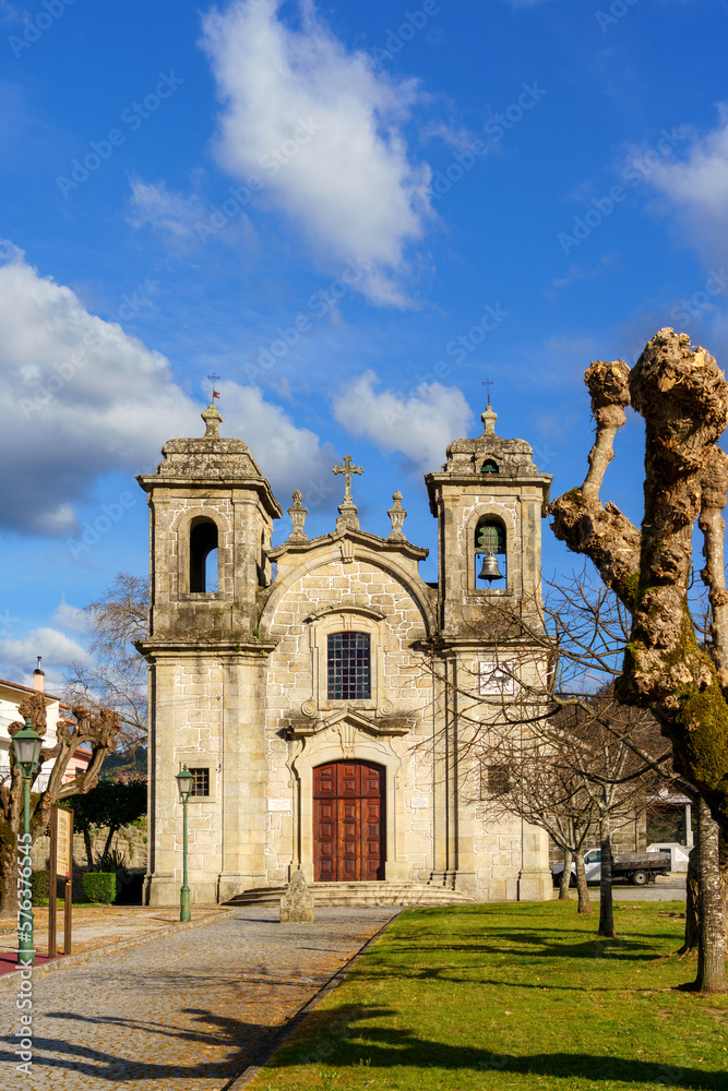 old stone rural village church with belltowers