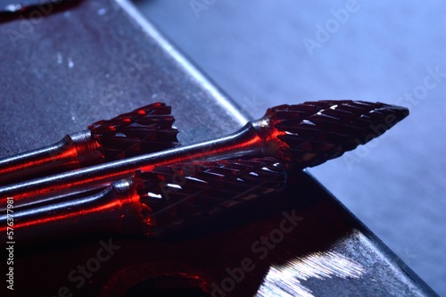 cutters of tungsten carbide on the background of metal blanks. Close-up.
