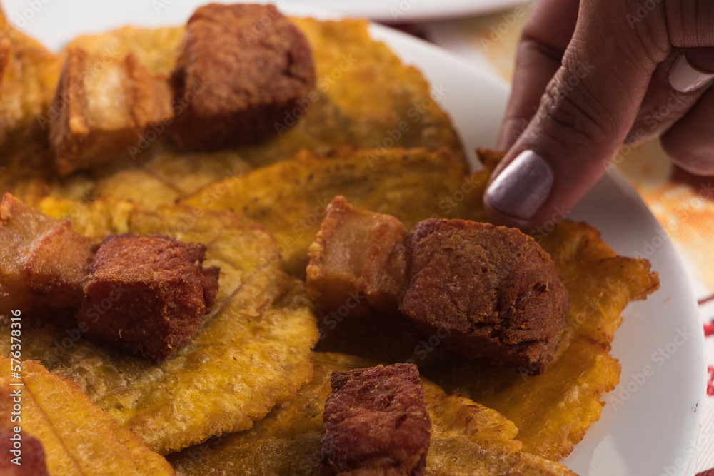 Detail of Colombian fried pork and plantain appetizer