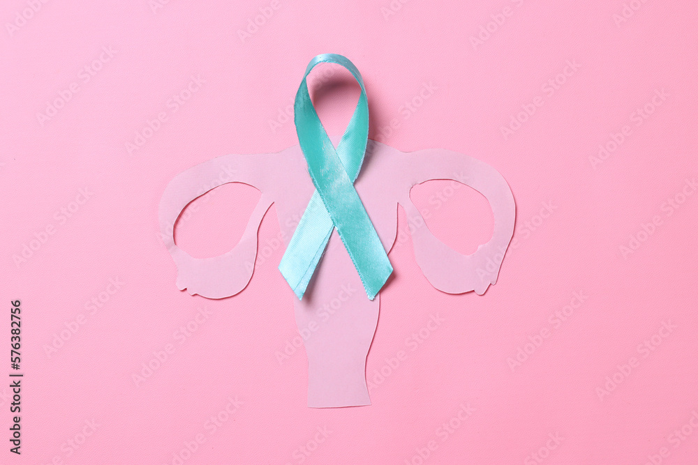 Teal awareness ribbon with cervix shape over pink background with copy space. Ovarian Cancer month, cervical cancer day. 