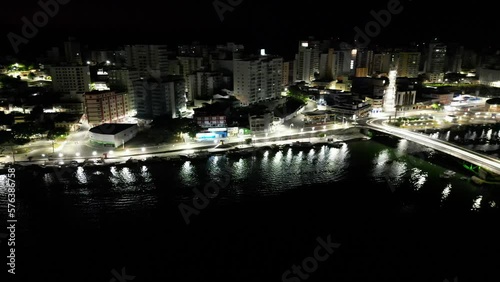 Imagem aérea noturna da cidade de Guarapari no Espírito Santo. Praia do Morro e Centro de Guarapari com luzes noturnas. photo