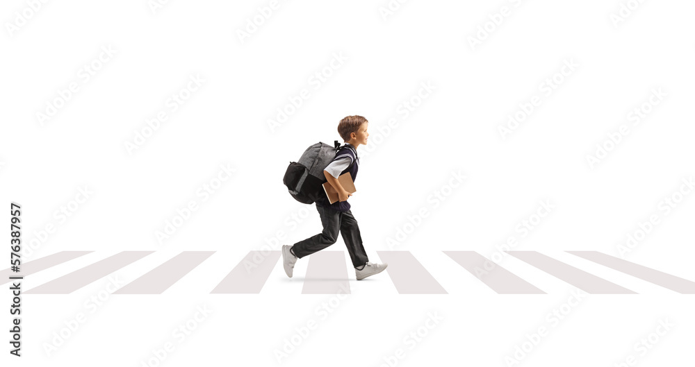 Schoolboy running on a pedestiran crossing Schoolboy running on a pedestiran crossing