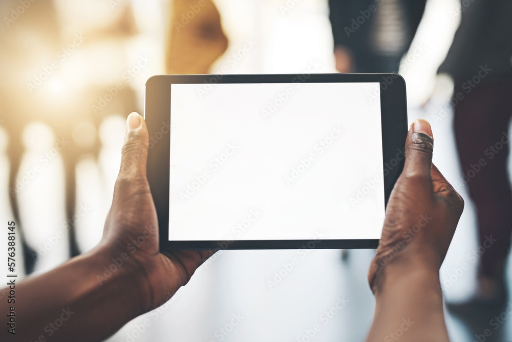 Work wirelessly with this device. Shot of an unrecognizable man using a tablet inside. Work wirelessly with this device. Shot of an unrecognizable man using a tablet inside.