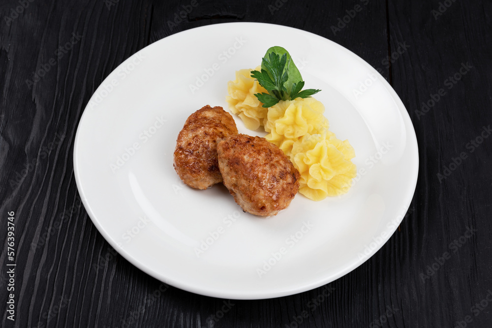 Chicken meat cutlet with mashed potatoes on white plate Chicken meat cutlet with mashed potatoes on white plate