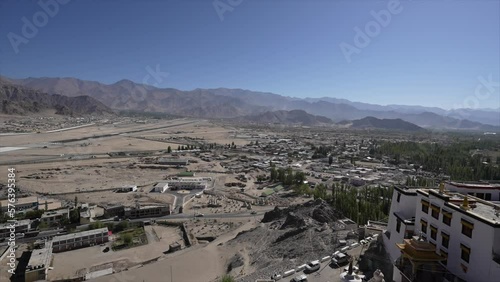 Leh airport with its runway and buildings with mountain range and blue clear sky photo