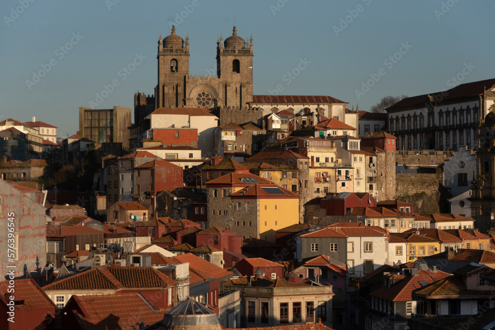 Cathedral, roofs and yellow houses at sunset in Porto, Portugal