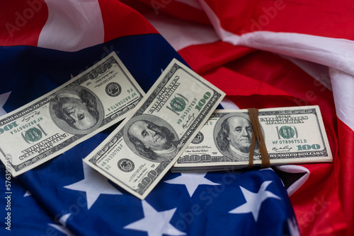 USA national flag and dollar bills. Business and finance concept