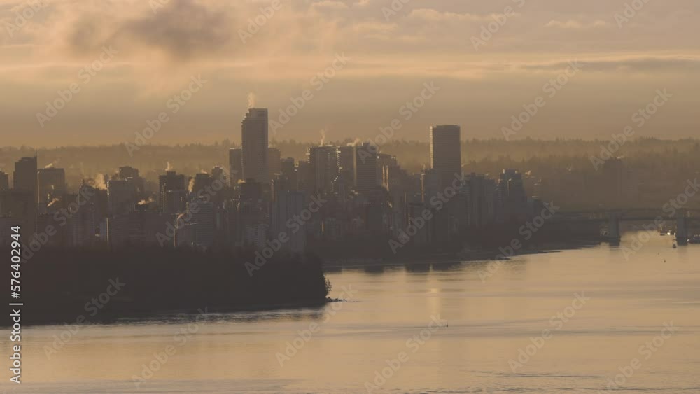 Modern City Skyline in Downtown Vancouver, British Columbia, Canada. Golden Winter Sunrise Sky. Slow Motion Cinematic