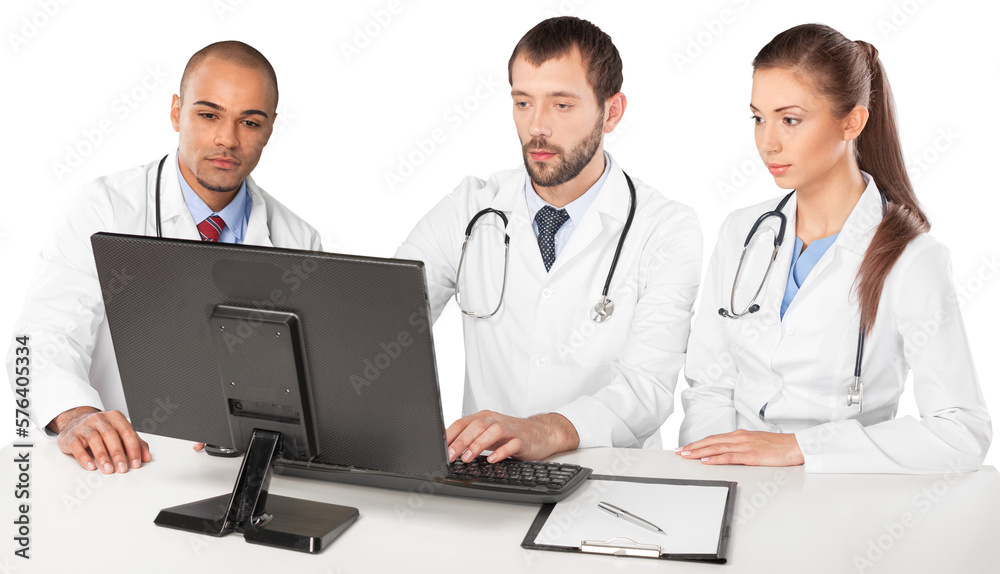 Portrait of Doctors Looking at Computer Monitor and Writing on Clipboard