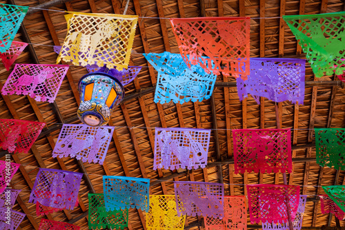 Colorful Mexican fiesta  decorations hang in a restaurant
