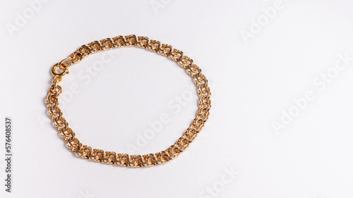 golden bracelet with white background