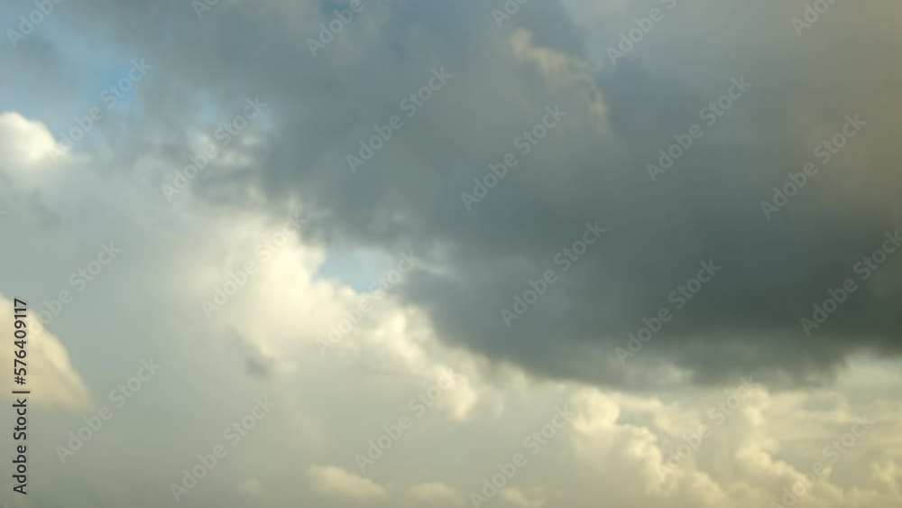 Time-lapse video of clouds moving rapidly in the morning sky