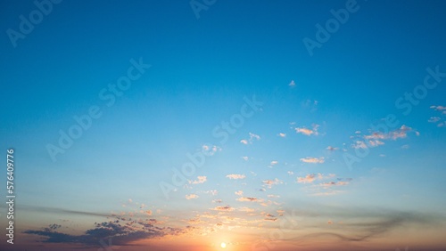 Sunset and clouds on blue sky