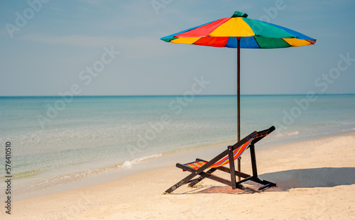 Deck chair with colorful an umbrella.tropical sandy beach  summer travel  vacation and summer holiday concepts.