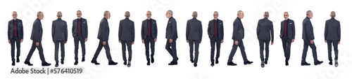 front, back and side view of same man with suit and tie walking on white background