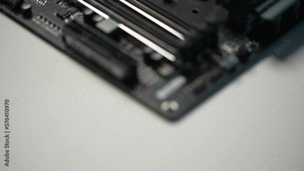 Close-up extreme selective focus of new motherboard, CPU installation slot, object macro, detail, extreme close up, nobody, no people. Shooting in slow motion. Close-up extreme selective focus of new motherboard, CPU installation slot, object macro, detail, extreme close up, nobody, no people. Shooting in slow motion.