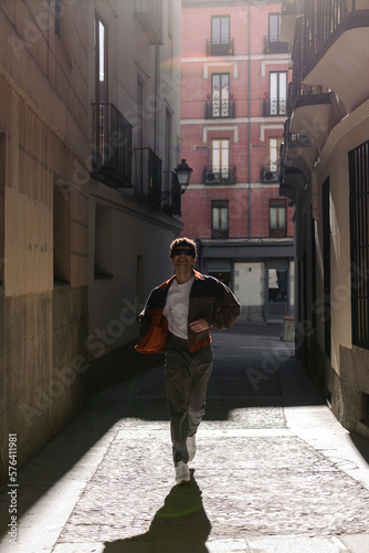 Young man running in the city
