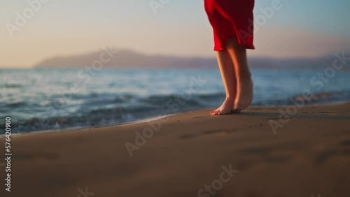 Wallpaper Mural Woman in red dress walks along the beach. Torontodigital.ca