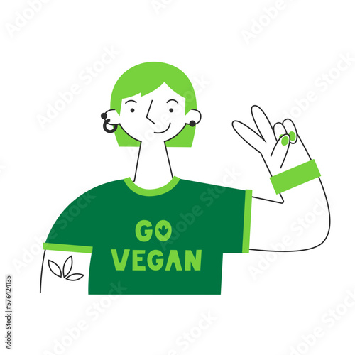 Woman in go vegan shirt. Vegetarian and plant-based healthy diet concept. Sustainable, cruelty-free, climate-friendly, meatless and dairy-free food. Meat and animal protein replacement.