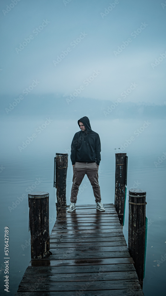 guy watching the sea, fog time
