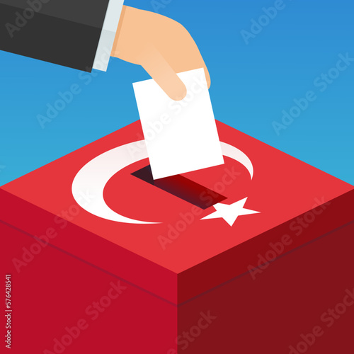 A hand places a ballot paper in an electoral box in the colors of the red Turkish flag with the crescent and the white star (flat design)