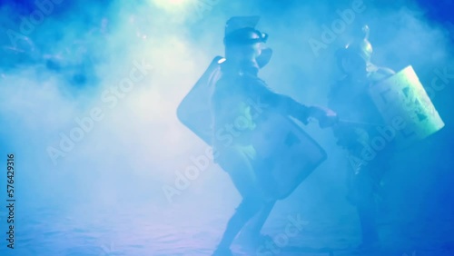 Two gladiators fight in the arena striking with swords and defending themselves with shields