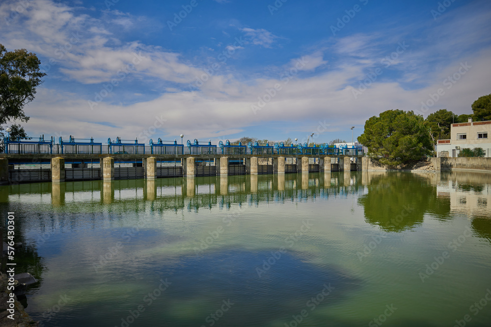 Fototapeta premium Closed lock on the river without ships. Blue sky with clouds