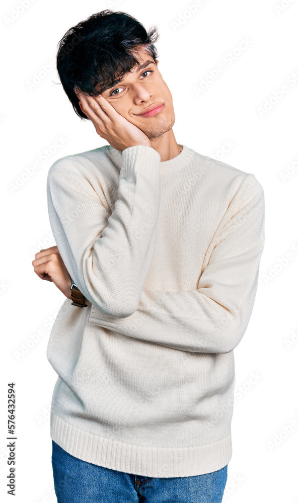 Handsome hipster young man wearing casual winter sweater thinking looking tired and bored with depression problems with crossed arms. Handsome hipster young man wearing casual winter sweater thinking looking tired and bored with depression problems with crossed arms.