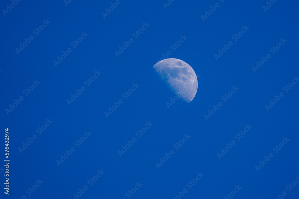Beautiful half moon on the clear blue sky Beautiful half moon on the clear blue sky