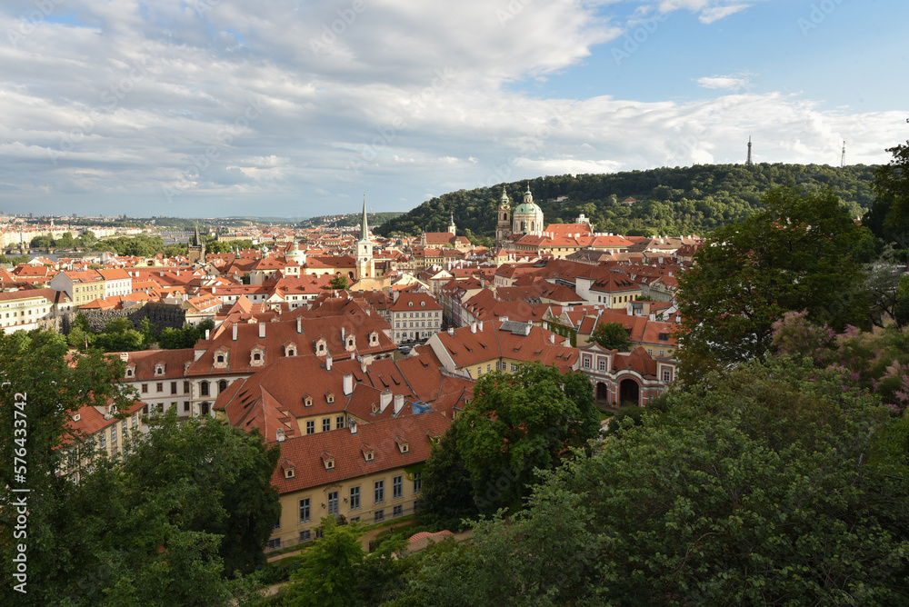 View on Prague city during summer with houses, trees and churches, Czech republic.