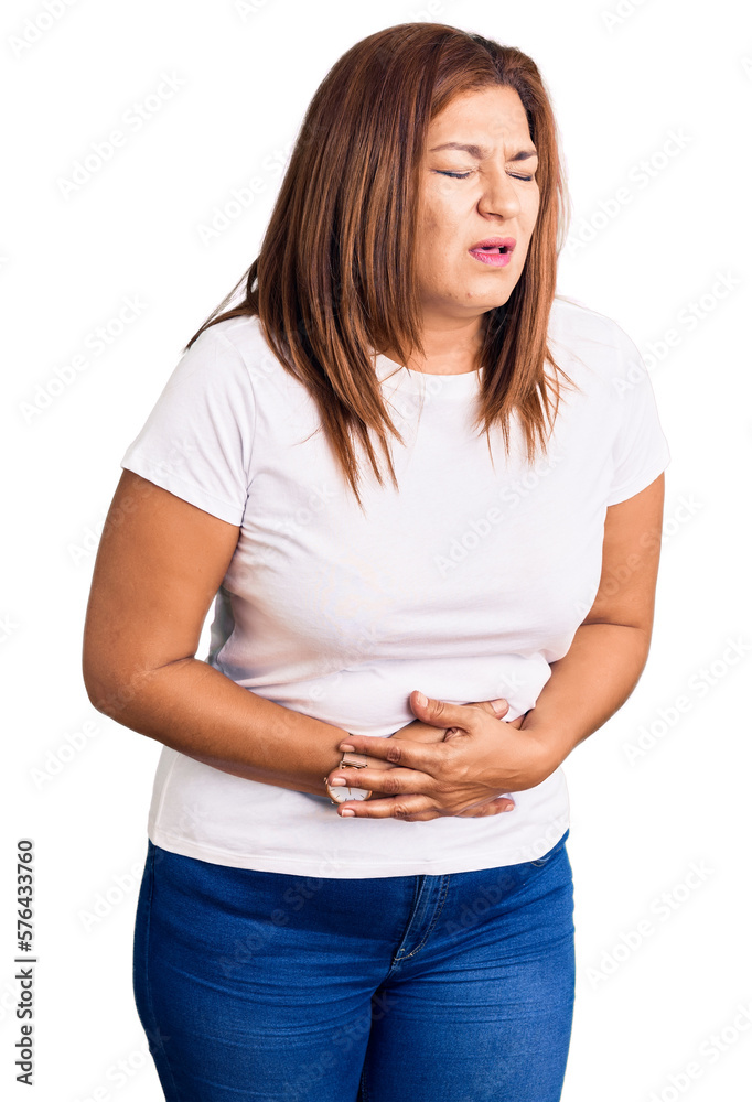 Middle age latin woman wearing casual white tshirt with hand on stomach because indigestion, painful illness feeling unwell. ache concept. Middle age latin woman wearing casual white tshirt with hand on stomach because indigestion, painful illness feeling unwell. ache concept.