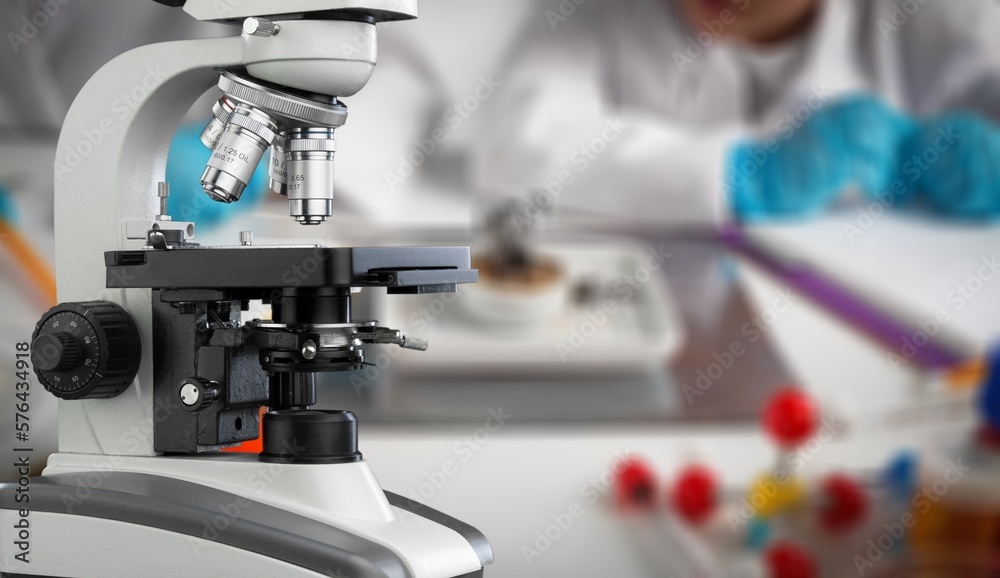 Modern microbiology microscope on table in laboratory, Modern microbiology microscope on table in laboratory,