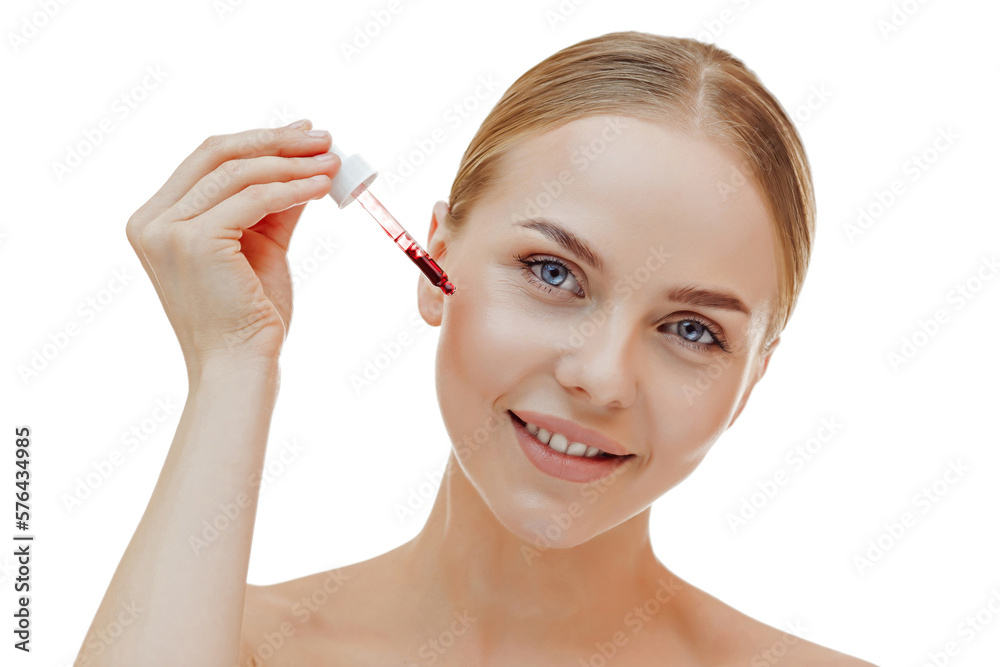 Beauty woman with freckles, naked shoulders and nude face, apply serum vitamin c, argan oil tea tree ingredients in pippette dropper under eye, treating skin for nourishing and moisturizing effect. Beauty woman with freckles, naked shoulders and nude face, apply serum vitamin c, argan oil tea tree ingredients in pippette dropper under eye, treating skin for nourishing and moisturizing effect.