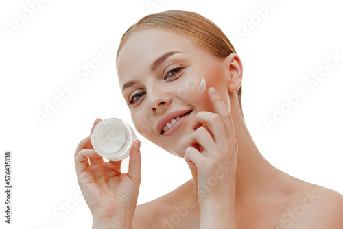 Beautiful woman with nature makeup smiling. Beauty portrait of female face holding and applying cosmetic cream. Skin care. Cosmetology, beauty and spa.