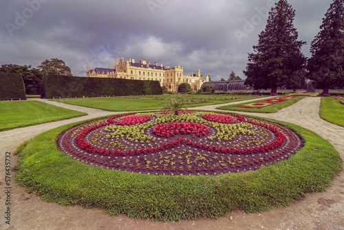 Fototapeta Naklejka Na Ścianę i Meble -  A view to the castle and flowers in garden at Lednice, Czech republic