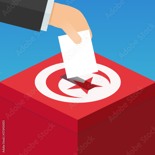 A hand places a ballot paper in an electoral box in the colors of the red Tunisian flag with the crescent and the star in a white circle (flat design)