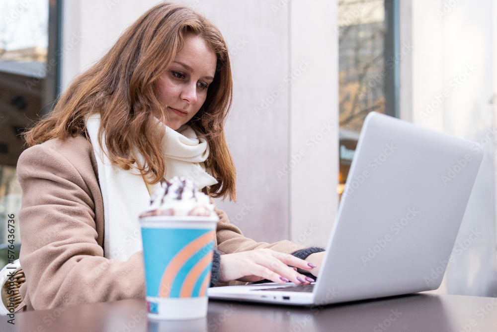 Woman with laptop and coffee Woman with laptop and coffee