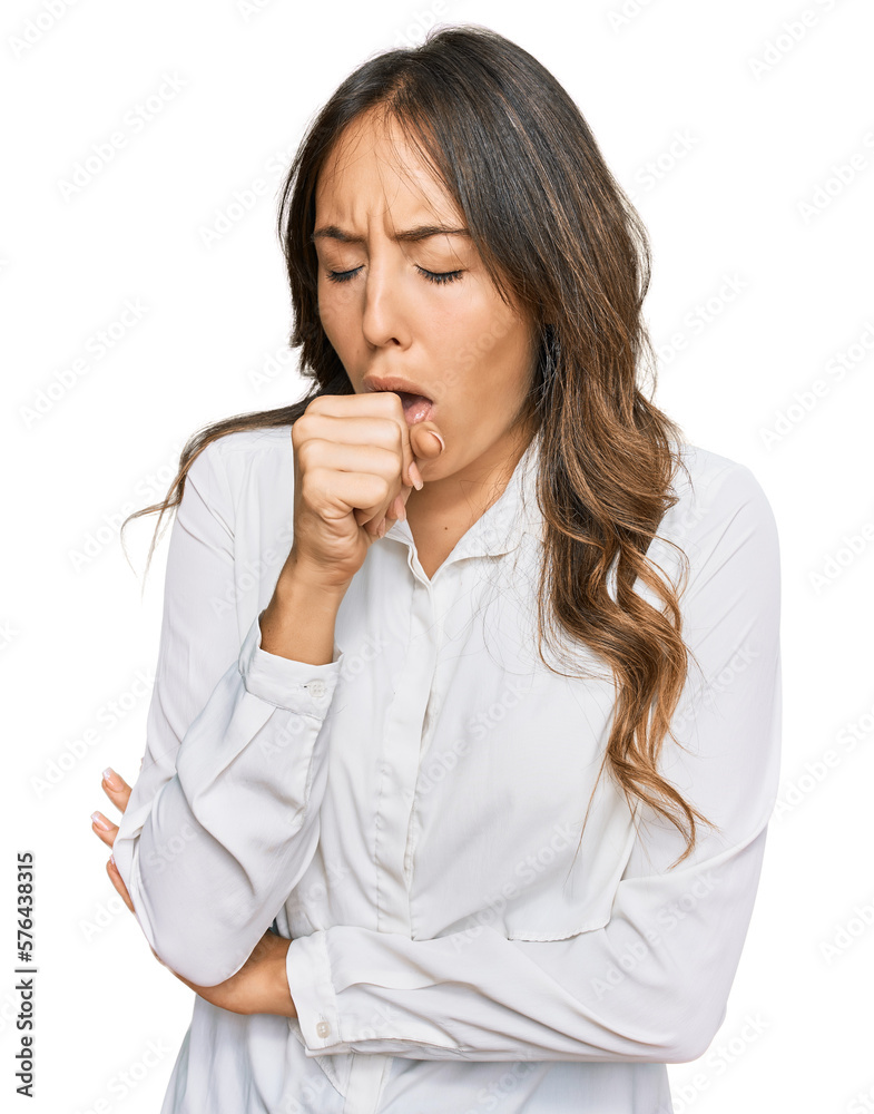Young brunette woman wearing casual clothes feeling unwell and coughing as symptom for cold or bronchitis. health care concept. Young brunette woman wearing casual clothes feeling unwell and coughing as symptom for cold or bronchitis. health care concept.
