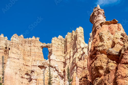 Close up scenic view of the wall of windows on Peekaboo hiking trail in Bryce Canyon National Park, Utah, USA. Massive steep hoodoo sandstone rock formations in natural amphitheatre in sunny summer © Chris